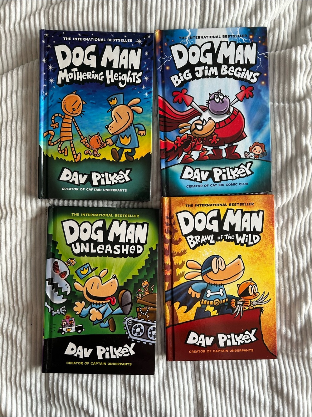 Dog Man 4-Book Set by – Blue, Green, Orange, Black Covers